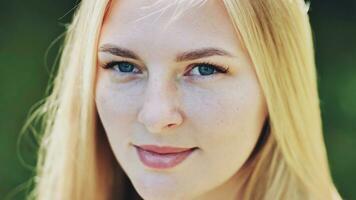 The face of a young Slavic girl blonde closeup. photo