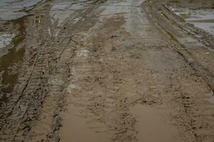 dirt tracks on the sand of the road, aerial view. photo