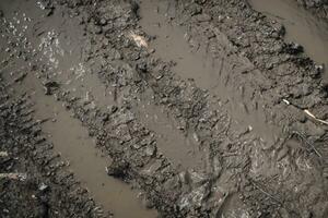 dirt tracks on the sand of the road, aerial view. photo