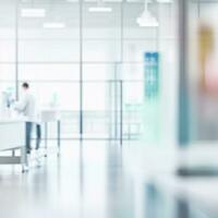 Bright clean empty corridor in modern medical hospital laboratory office blurred interior white room background photo