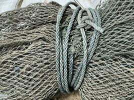 old fishing net with rope photo