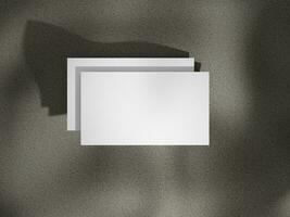 Top view business card mockup with natural shadow light photo