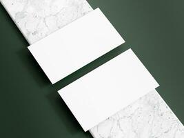 Business card mockup with dark green background photo