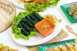 Grilled Pork Wrapped in Wild Betel Leaf. Vietnamese food photo