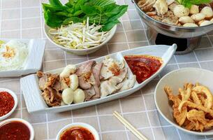 Soft Boiled Mixed Meat with Spicy Dip.  Thicken Boat Noodles Soup photo