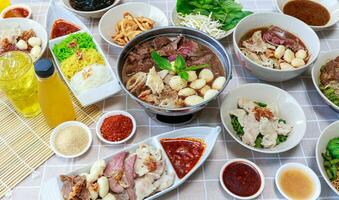 Thai boat noodles with Thai spices and ingredient on background. photo