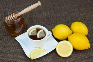 Cup of tea with honey and lemon. photo