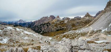 Panoramic view of the famous peaks of the Dolomites, Tre Cime di Lavaredo National Park, Dolomiti Alps, South Tyrol, Italy photo