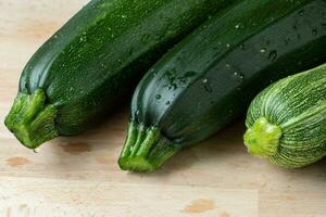 Fresh zucchini on cutting board photo