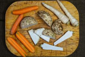 Mix of fresh vegetables on a wooden board, healthy food photo