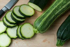 Fresh zucchini on cutting board photo