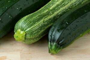 Fresh zucchini on cutting board photo