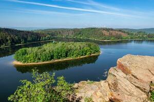 Lake and island with trees. Water reservoir Sec, Czech Republic, Europe photo