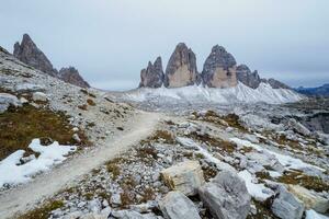 View of famous Tre Cime peaks from the mountain Toblinger Knoten. Tre Cime di Lavaredo National Park, Dolomiti Alps, South Tyrol, Italy. photo