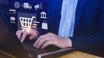 Shopping Online. hand online shopping on laptop computer with virtual graphic icon diagram, payment online, digital marketing, business finance, internet network technology concept. photo