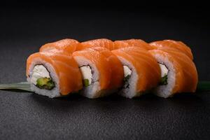 Delicious Philadelphia sushi roll with salmon, shrimp, cucumber and cream cheese photo