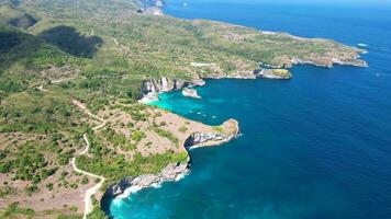 Aerial video of Kelingking Beach, Nusa Penida is one of the most incredible place for visit in Indonesia the eyes of travelers have a view amazing natural landscape. Bali, Indonesia, Desember 4, 2023