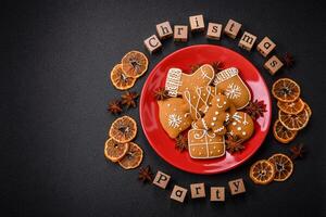 Christmas party inscription with wooden cubes on a dark concrete background photo