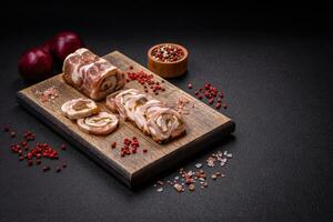 Delicious meatloaf with lard, salt, spices and herbs cut into slices photo