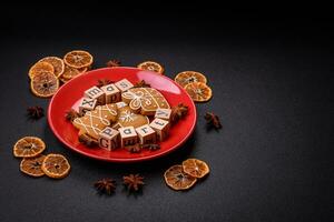 Christmas party inscription with wooden cubes on a dark concrete background photo