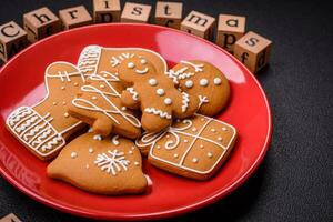 Christmas party inscription with wooden cubes on a dark concrete background photo