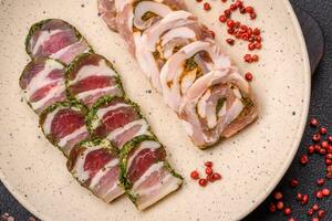 Delicious meatloaf with lard, salt, spices and herbs cut into slices photo