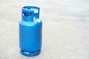 Blue LPG gas cylinder tank. Concept , Gas for cooking in daily life. Gas tank used with stove. Copy space for adding text or advertisement. photo