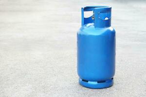 Blue LPG gas cylinder tank. Concept , Gas for cooking in daily life. Gas tank used with stove. Copy space for adding text or advertisement. photo