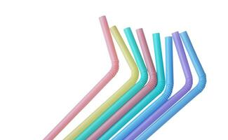 Colorful plastic drinking straws tubes for juice and cocktails, white background. Concept, single use equipment for drinking, but can use for diy crafts for decoration. photo