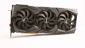 big black contemporary gaming graphics card on white background loopable spinning closeup view video