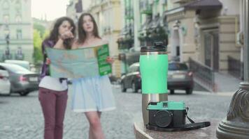 Two women using a map while wandering in the city video