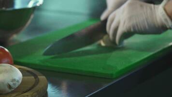 Close up of a chef slicing muschrooms on cutting board video