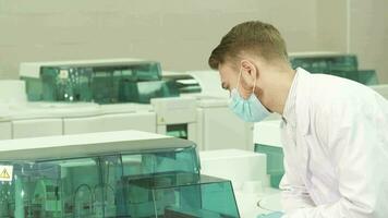 Serious lab technician has started a laboratory centrifuge video