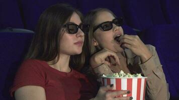 Two friends are discussing a movie in the cinema video