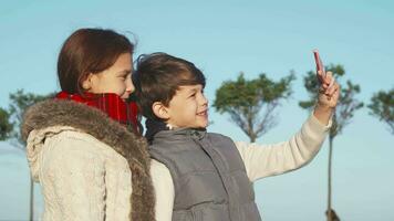 Modern children make selfies on the phone video