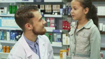 Good pharmacist gives a little girl medicine video