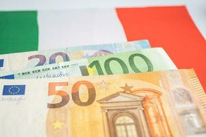 Italy flag on Euro banknotes, Business and finance concept. photo