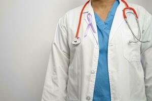 Asian woman doctor with purple ribbon, sign of Alzheimer disease day, Pancreatic cancer, Epilepsy, Lupus. photo