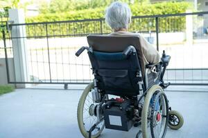 Asian senior woman patient on electric wheelchair, healthy strong medical concept. photo