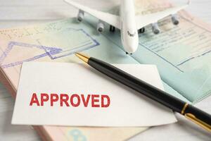 Approved Stamp visa and passport document to immigration at airport in country. photo