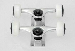 skateboard wheels are shown on a white surface photo