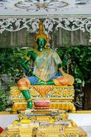 a statue of a buddha in a temple photo