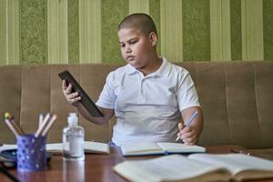 Boy studying at home photo