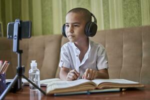 Boy studying from home during the pandemic photo