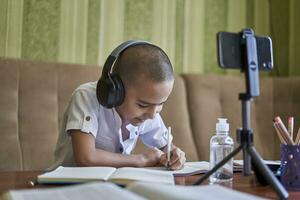 Boy studying from home during the pandemic photo