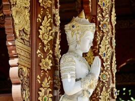 White buddha statue at Wat Phra Singh in Chiang Rai, Buddha statue at the ancient temple, peaceful image of a Buddha statue, The Phra Sihing Buddha or Phra Singh is a statue of Lanna art photo