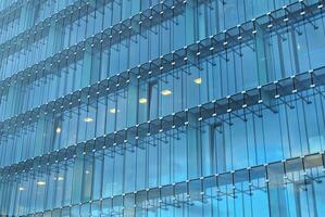 Fragment of glass and metal facade walls. Commercial office buildings. Abstract modern business architecture. photo