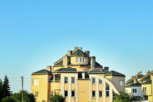 Brand new apartment building on sunny day. Modern residential architecture. Modern multi-family apartment house. photo