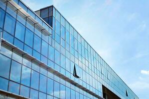 Fragment of glass and metal facade walls. Commercial office buildings. Abstract modern business architecture. photo