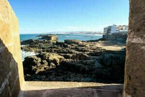 view from the window of a stone wall photo